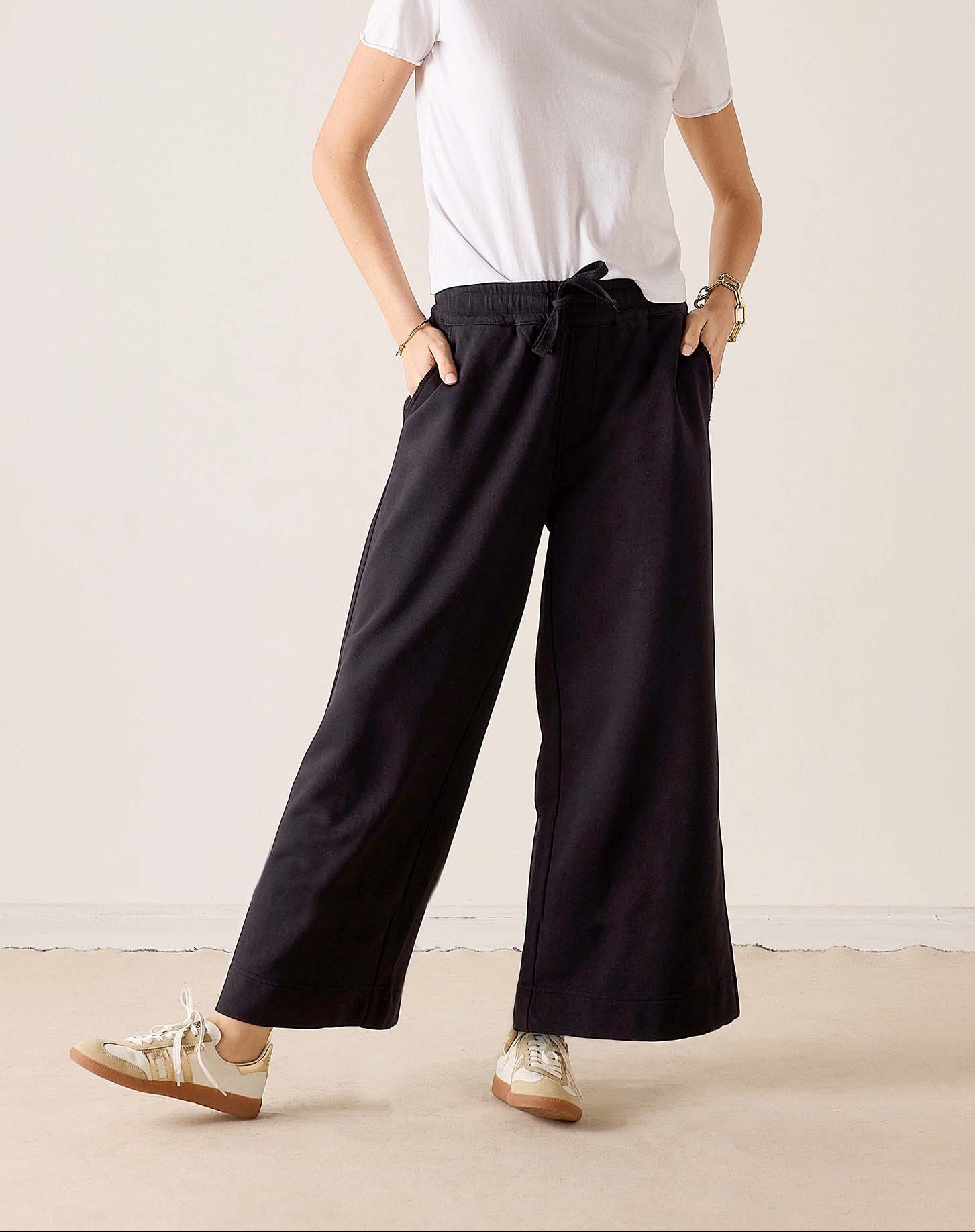 MERSEA women's travel-friendly black wide-leg trousers with an elasticated waist.