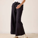 Black wide-leg trousers with a high-waist and drawstring waist.