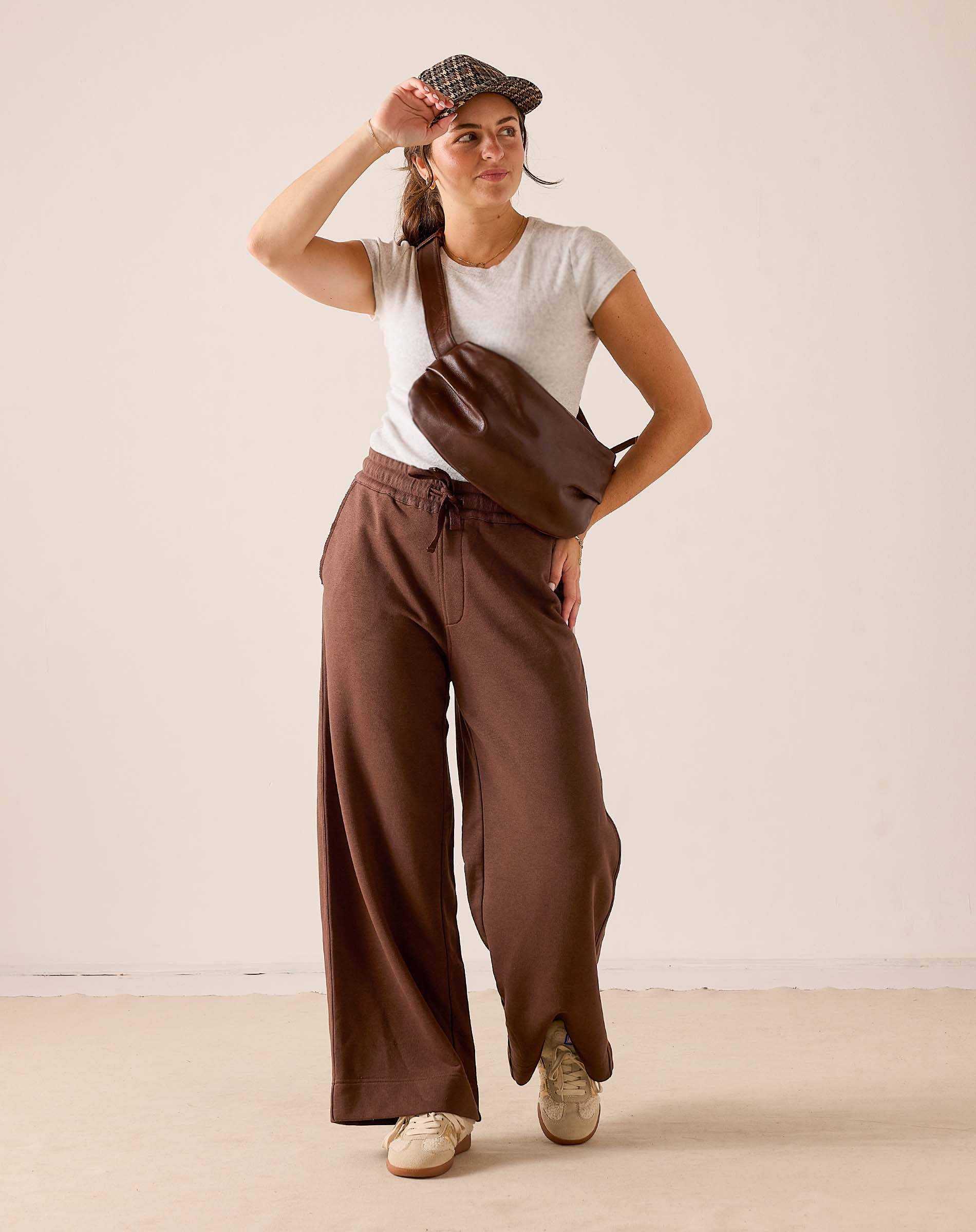 MERSEA women's travel-friendly espresso wide-leg trousers in a soft, flowing fabric with an elastic waistband.