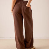 Espresso brown wide-leg pants in a soft knit fabric with a front patch pocket.