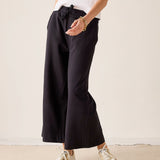 MERSEA ladies' travel-ready black wide-leg pants featuring a gathered waist and soft fabric.