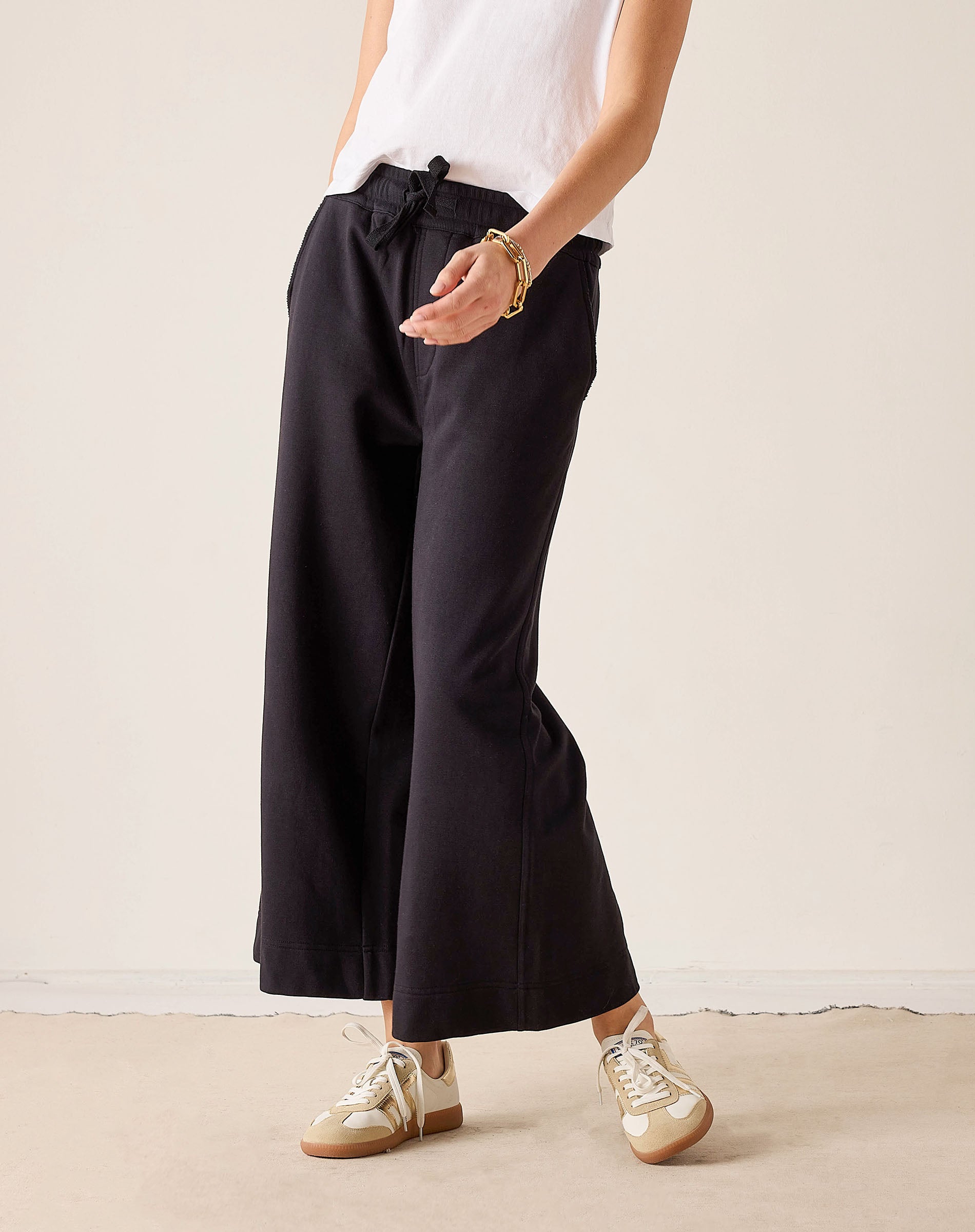 MERSEA ladies' travel-ready black wide-leg pants featuring a gathered waist and soft fabric.