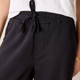 MERSEA ladies' travel-ready black wide-leg pants with a drawstring waist and flat front pocket.