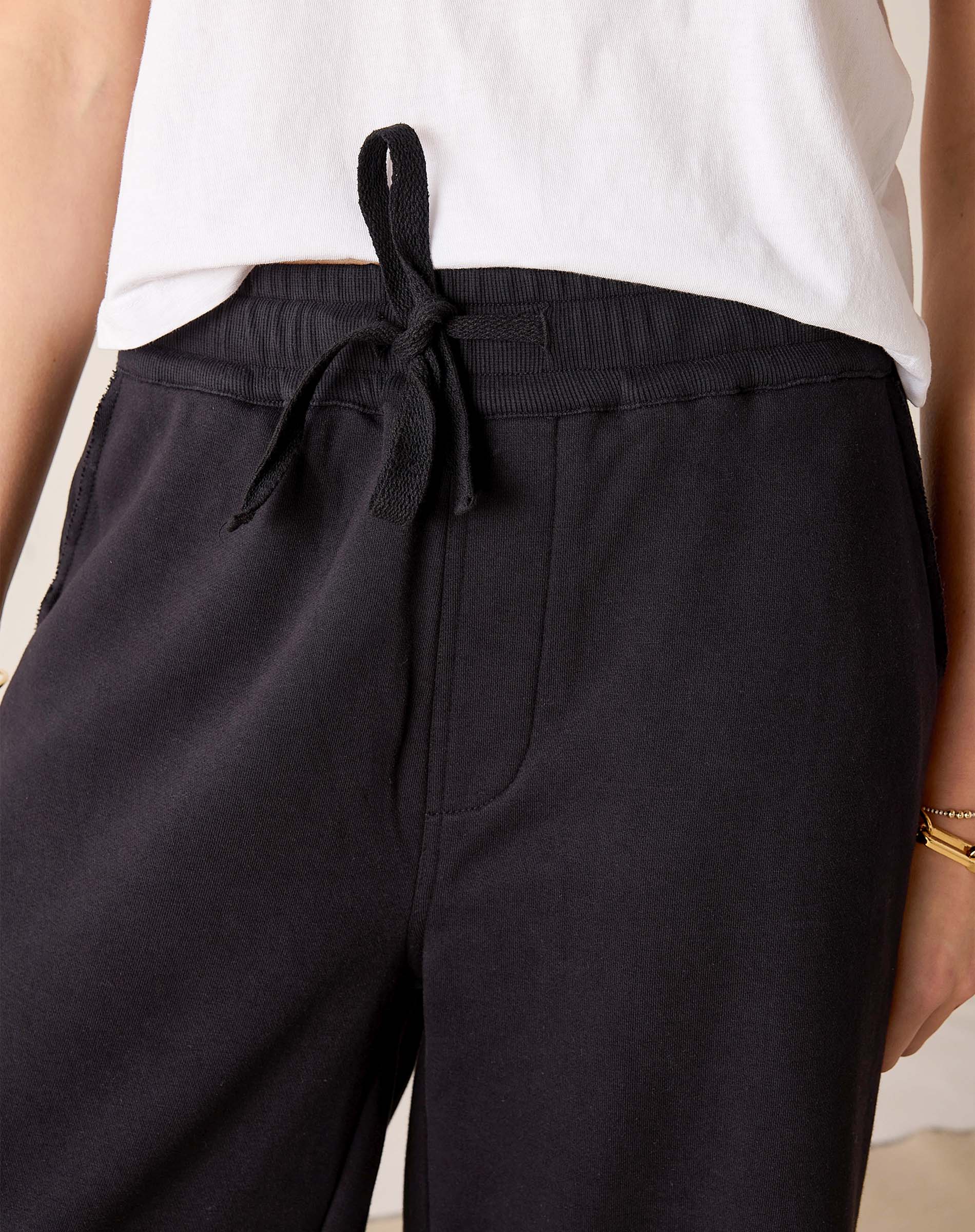 MERSEA ladies' travel-ready black wide-leg pants with a drawstring waist and flat front pocket.