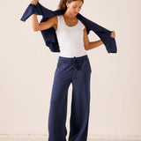 Women's travel-friendly cadet blue wide-leg pants in a soft linen-blend fabric.