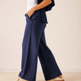 Cadet blue wide-leg pants in a soft fabric with unique paneling details.