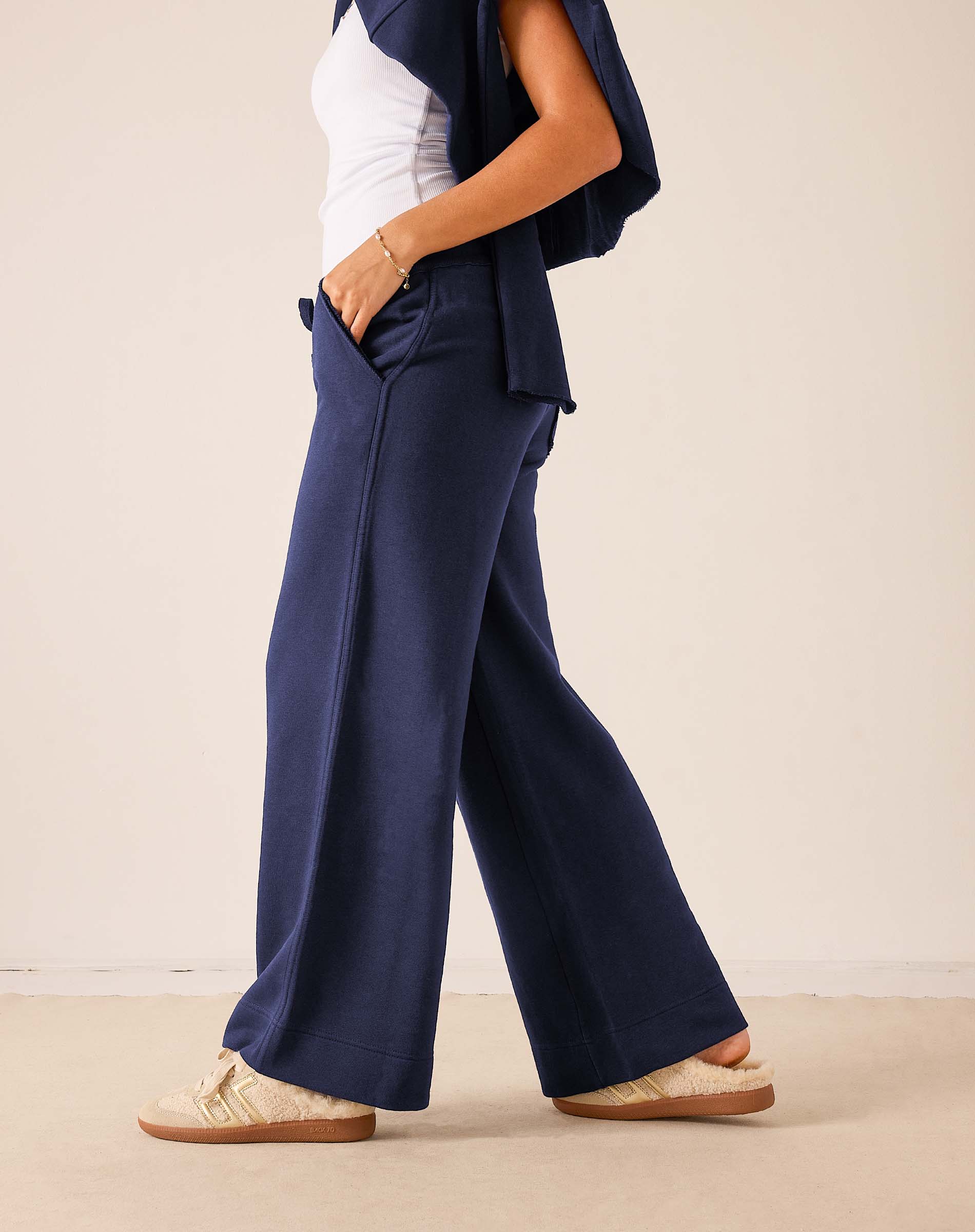 Cadet blue wide-leg pants in a soft fabric with unique paneling details.