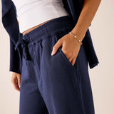 Cadet blue wide-leg pants in a soft jersey knit with a drawstring waist and front pockets.