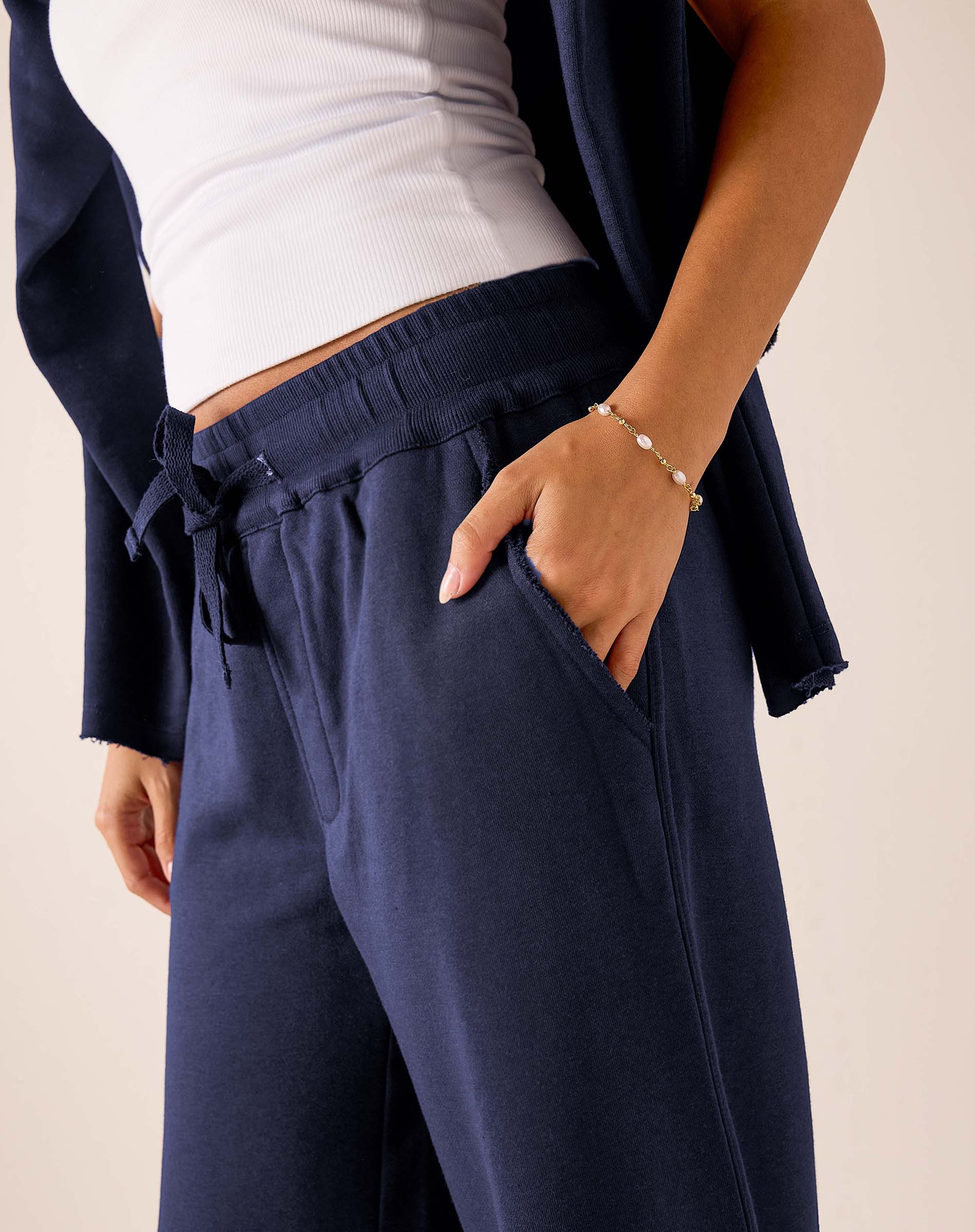 Cadet blue wide-leg pants in a soft jersey knit with a drawstring waist and front pockets.