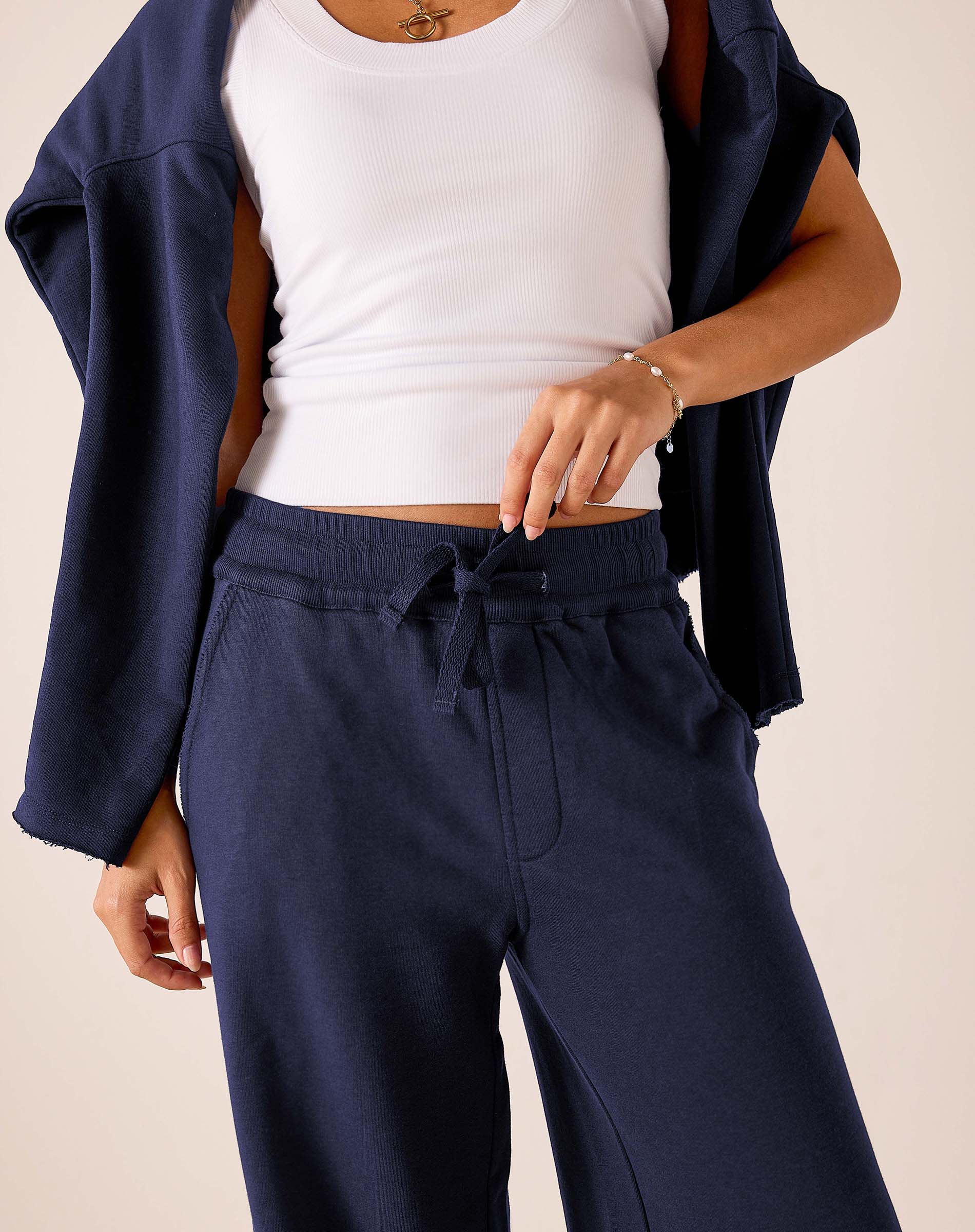 Cadet blue wide-leg pants with a drawstring waist and soft knit finish.