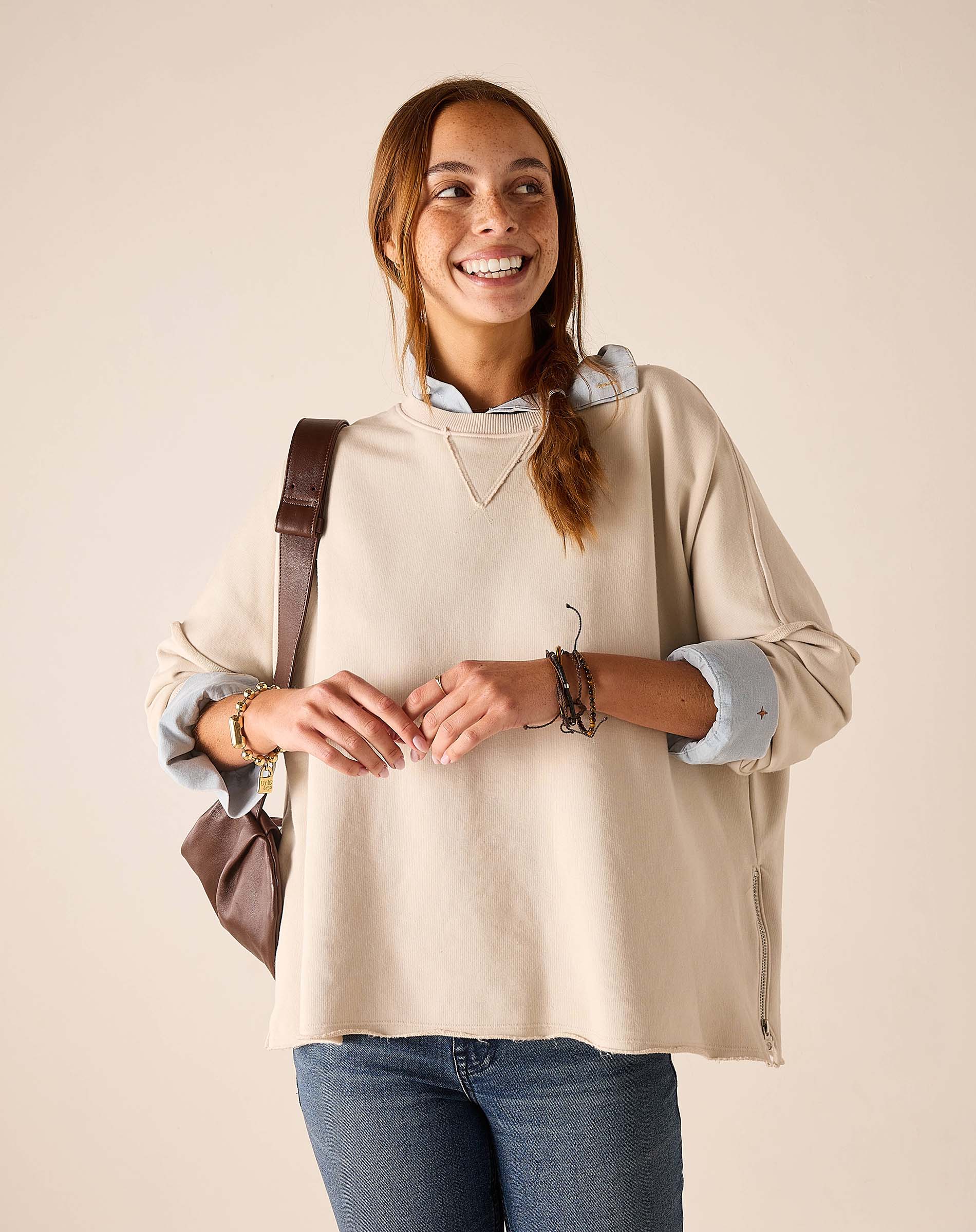 MERSEA women's travel-friendly bone side crewneck knit top with a zipper detail and long sleeves.