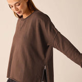 Espresso brown knit crewneck top with a zip detail and relaxed fit.