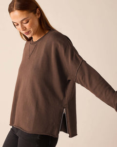 Espresso brown oversized crewneck sweater featuring a side zipper detail.