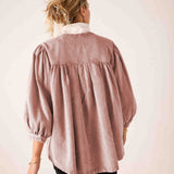 Back view of women's travel-friendly blush-toned, loose-fit gathered-waist cotton-blend blouse with voluminous balloon sleeves and smocked cuffs.