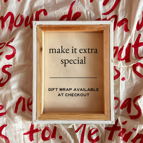 Wooden frame with text on a background of crumpled paper with red text.