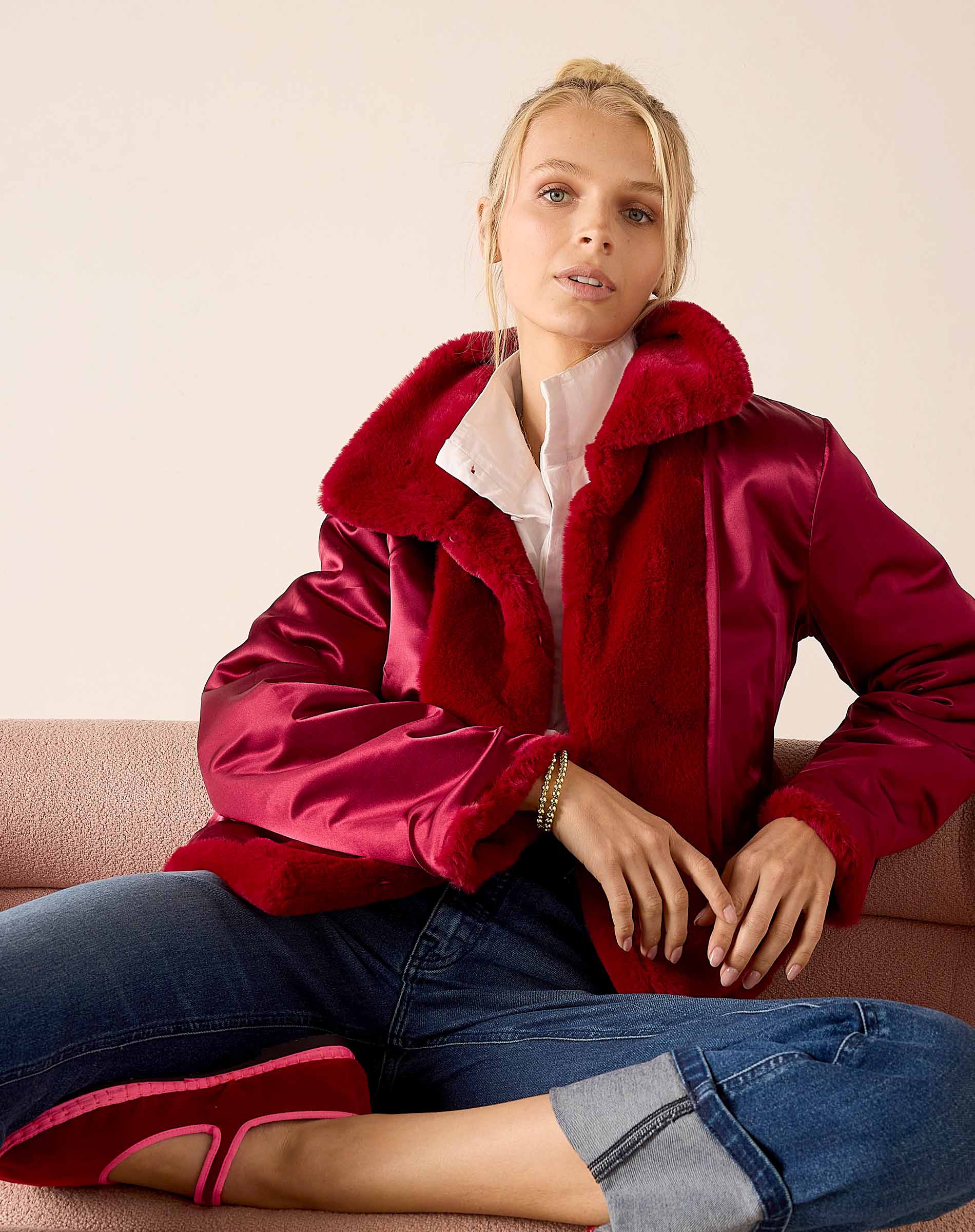 Garnet satin finish reversible jacket with plush faux fur collar.