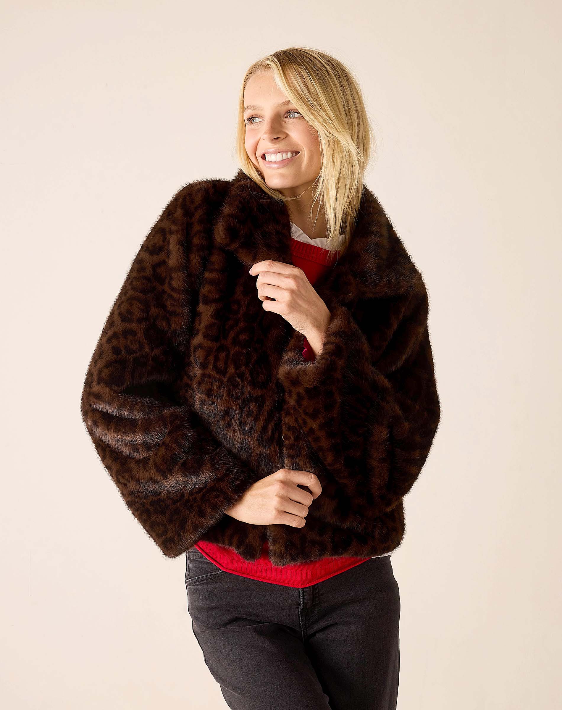 Ladies' travel-ready leopard print faux fur jacket in dark brown and tan.