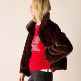 Leopard print faux fur jacket in brown and tan tones.