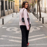 Ladies' travel-ready ballet pink cashmere knit sweater with drop shoulders and wide sleeves.