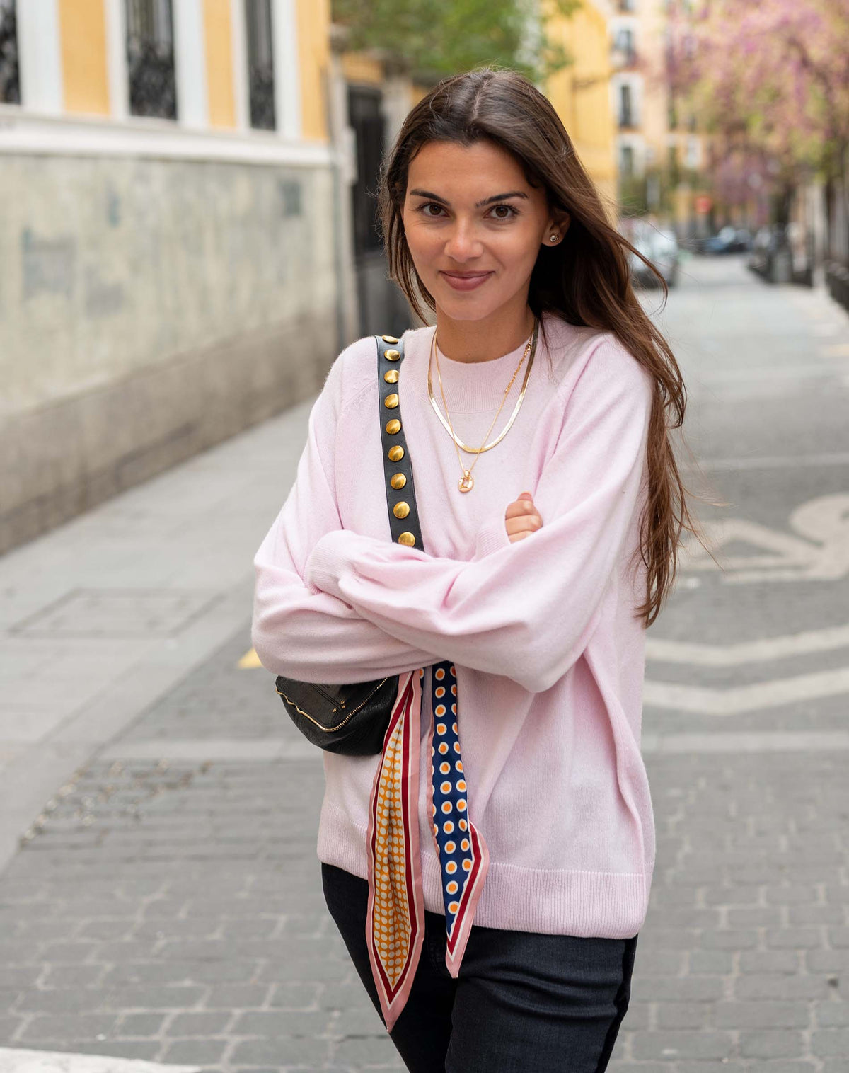 Ballet pink cashmere sweater with a soft knit texture and relaxed fit.