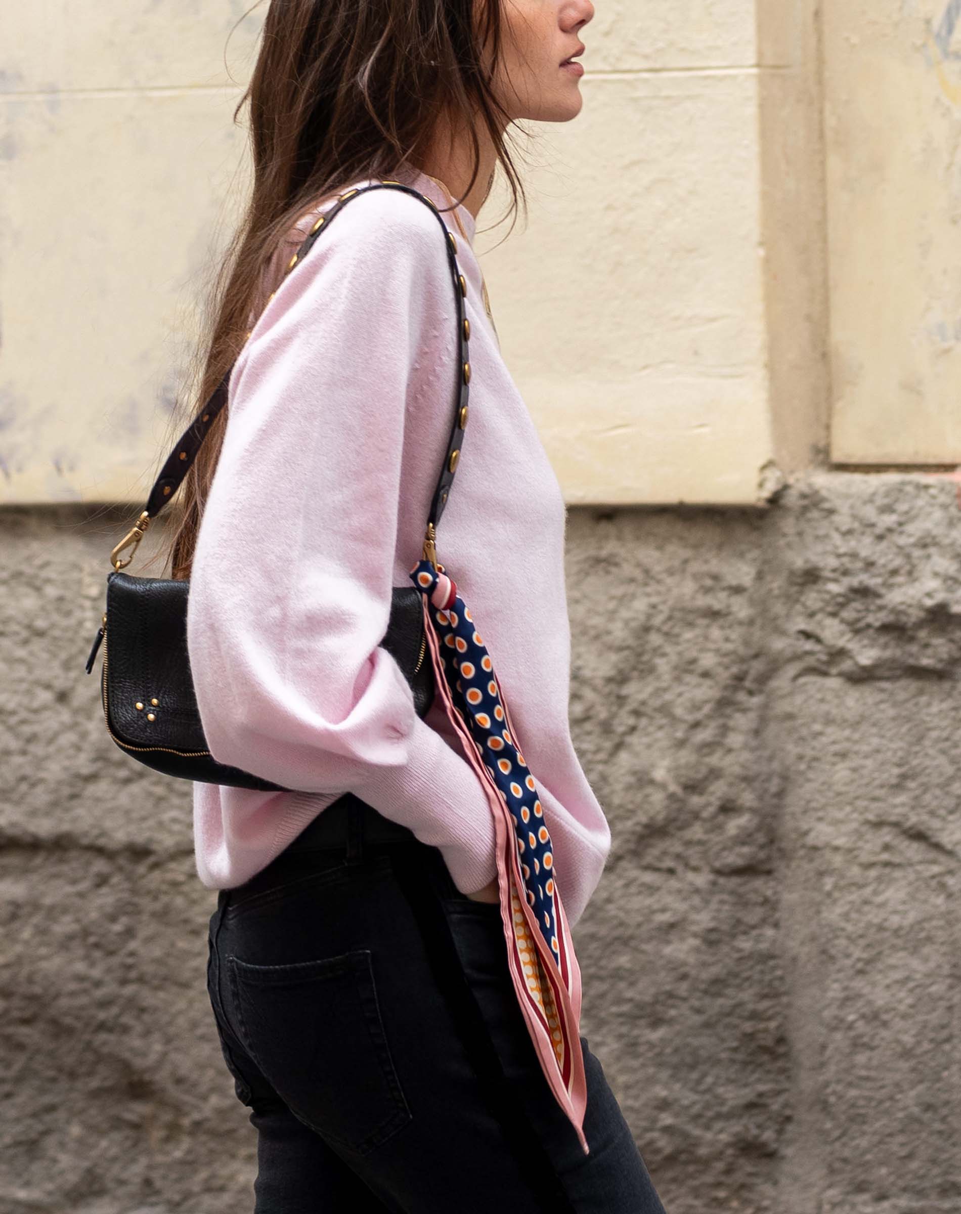 Ballet pink knit sweater with a relaxed fit and long sleeves.