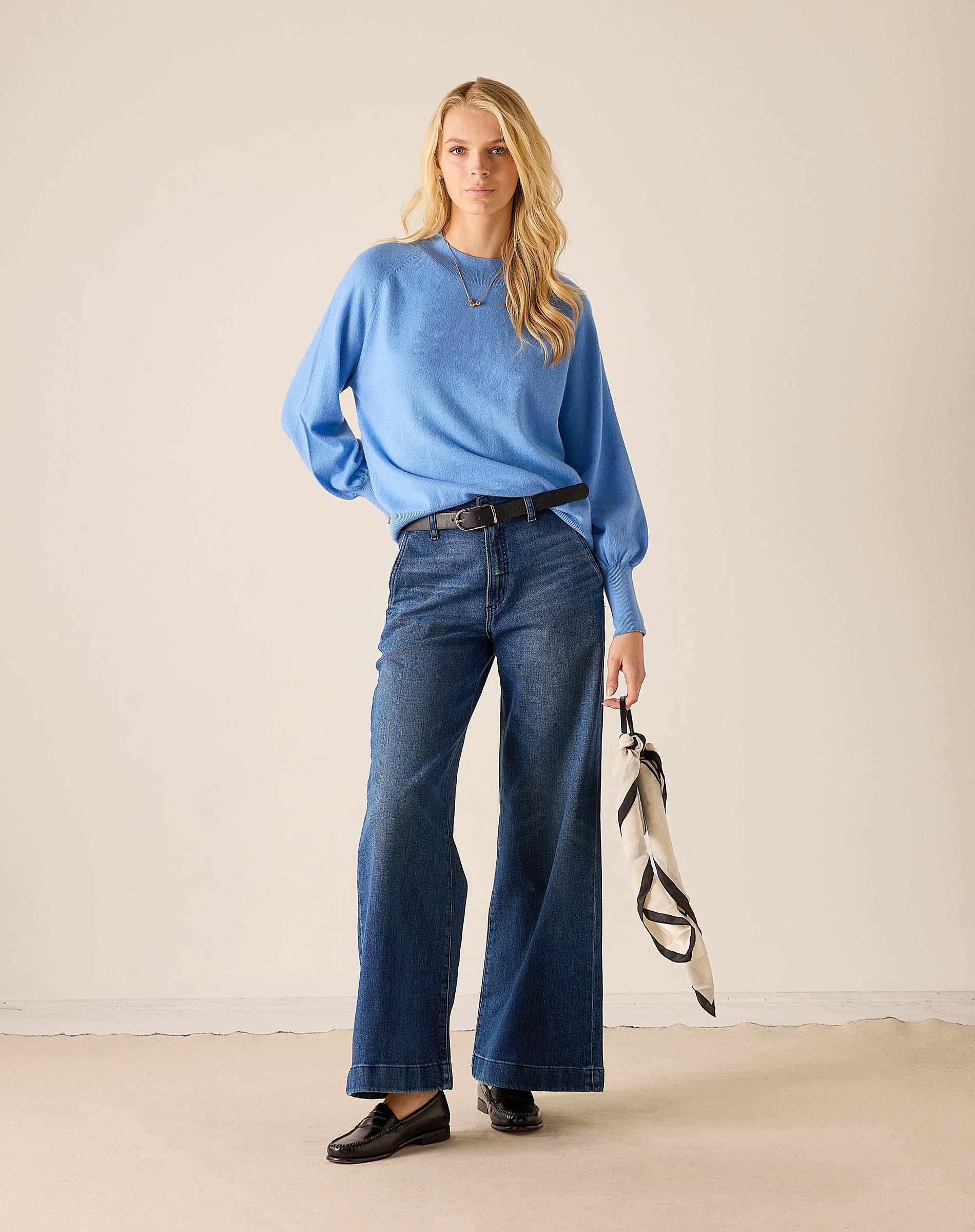 Ladies' travel-ready cobalt blue oversized knit sweater with voluminous sleeves and a ribbed hem.