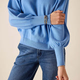 Cobalt blue ribbed knit sweater with drop shoulder detail.