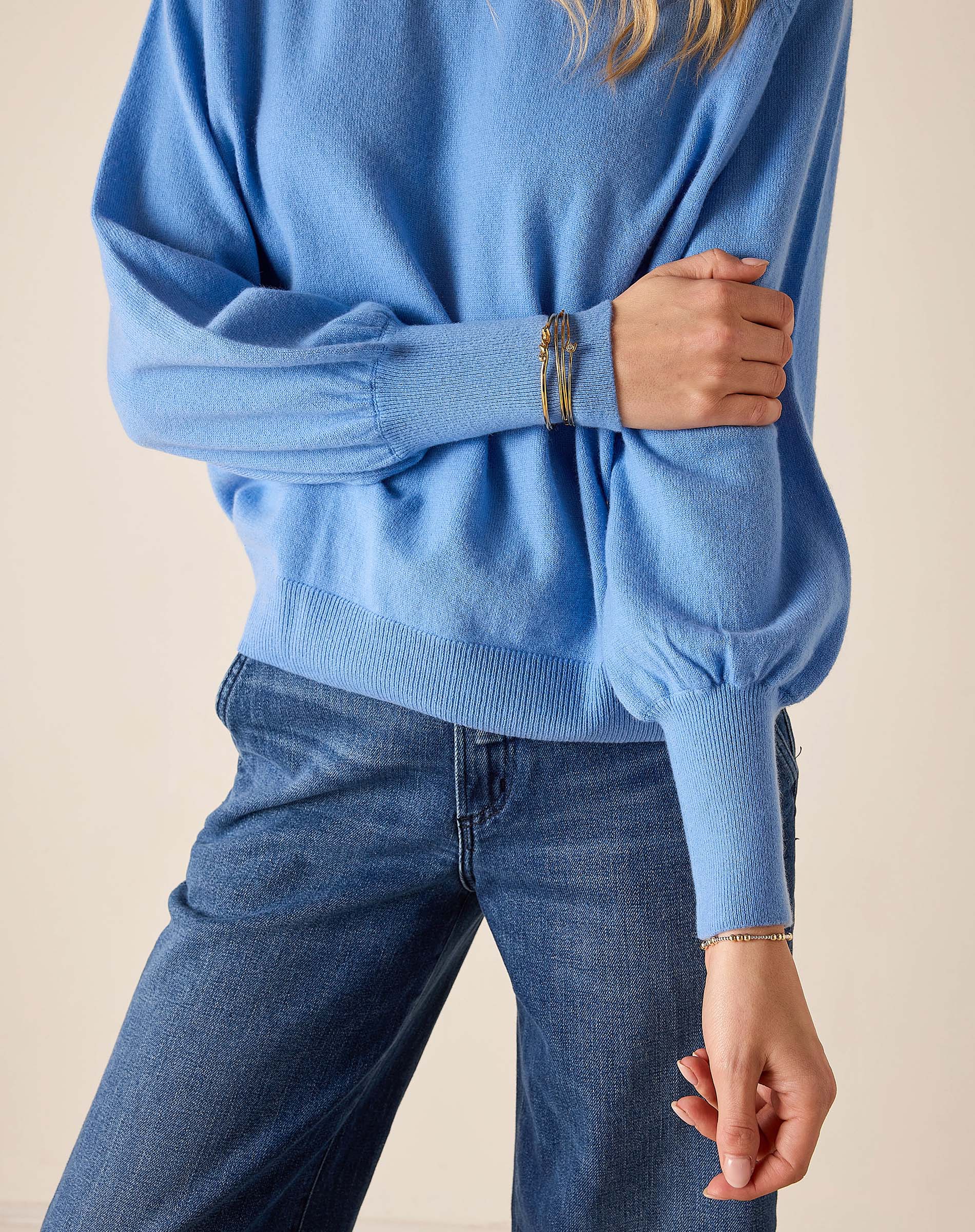 Cobalt blue ribbed knit sweater with drop shoulder detail.