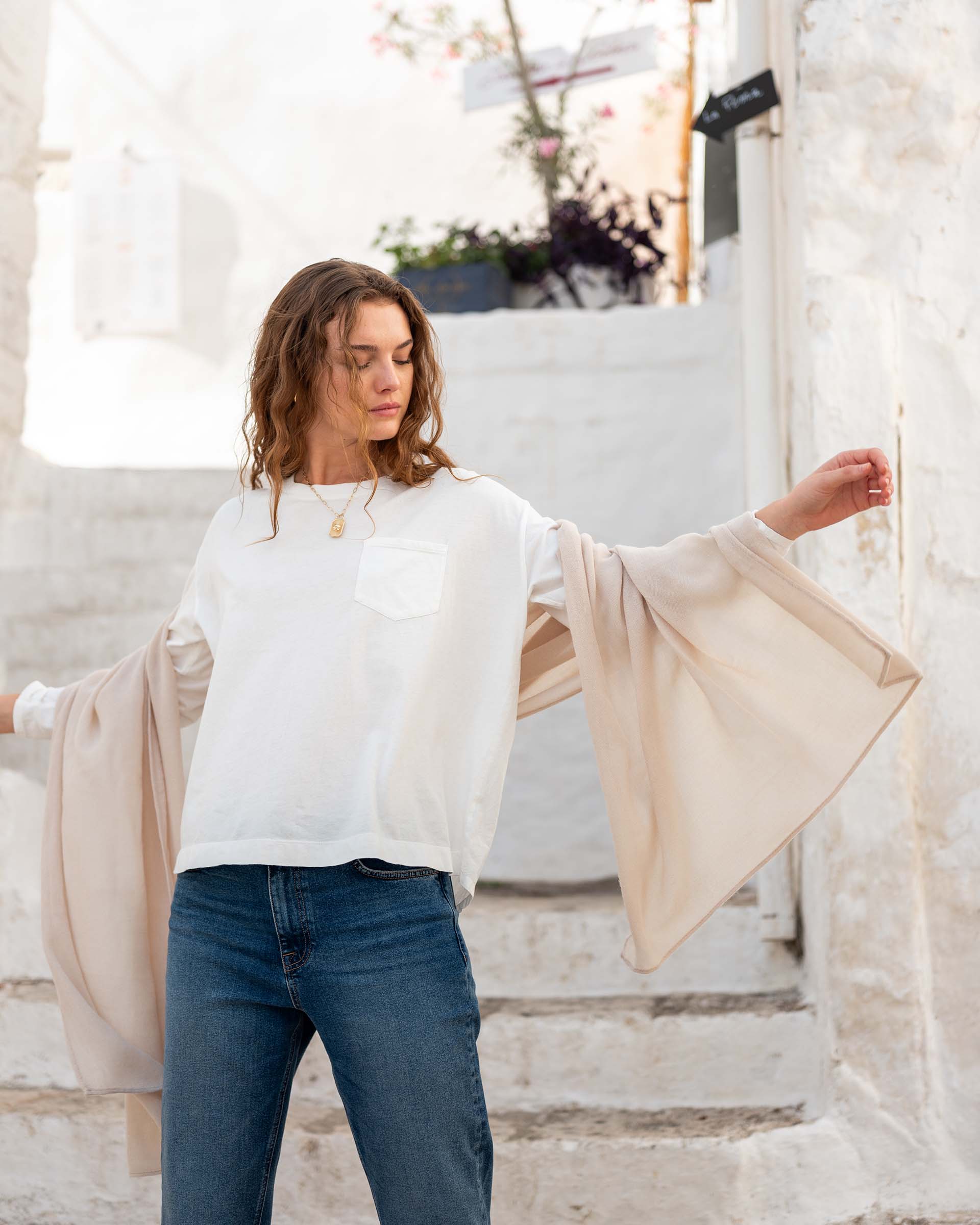 MERSEA women's travel-friendly women's travel-friendly moonstone colored wide-sleeve wrap worn over a white t-shirt and blue jeans.