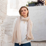 woman wearing golightly scarf around neck in moonstone