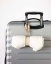 suitcase with golightly travel strap hooked onto handle