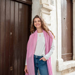 woman smiling wearing golightly scarf in pink