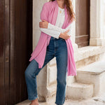 woman wearing golightly scarf around shoulders in pink