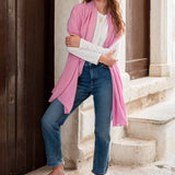 woman wearing golightly scarf around shoulders in pink