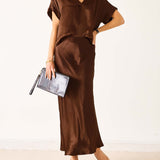 Chocolate brown boxy satin top with short sleeves and a relaxed fit.
