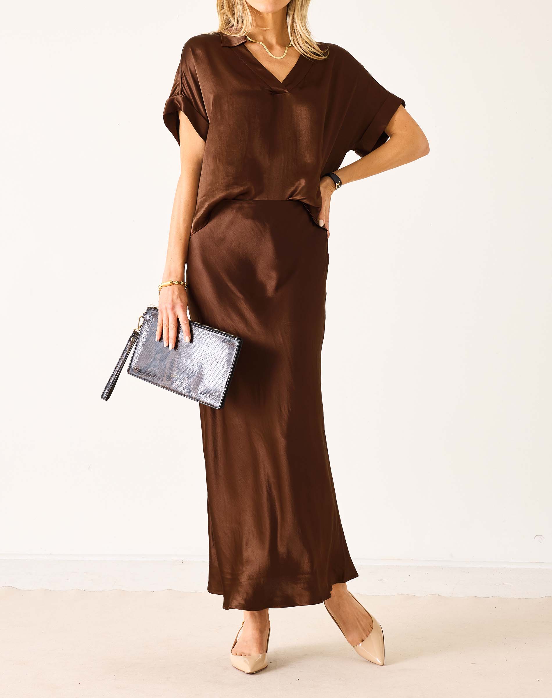 Chocolate brown boxy satin top with short sleeves and a relaxed fit.
