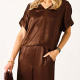 Chocolate brown boxy silk blend top with wide sleeves and a draped neckline.