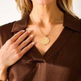 Chocolate brown boxy top in a smooth satin-like fabric with a notch lapel collar.