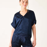 Navy blue boxy silk blend top with short sleeves and a split neckline.