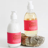 cabana flower hand soap and lotion on a rock