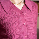Rhubarb color button-down knit sweater with textured ribbed weave and collar