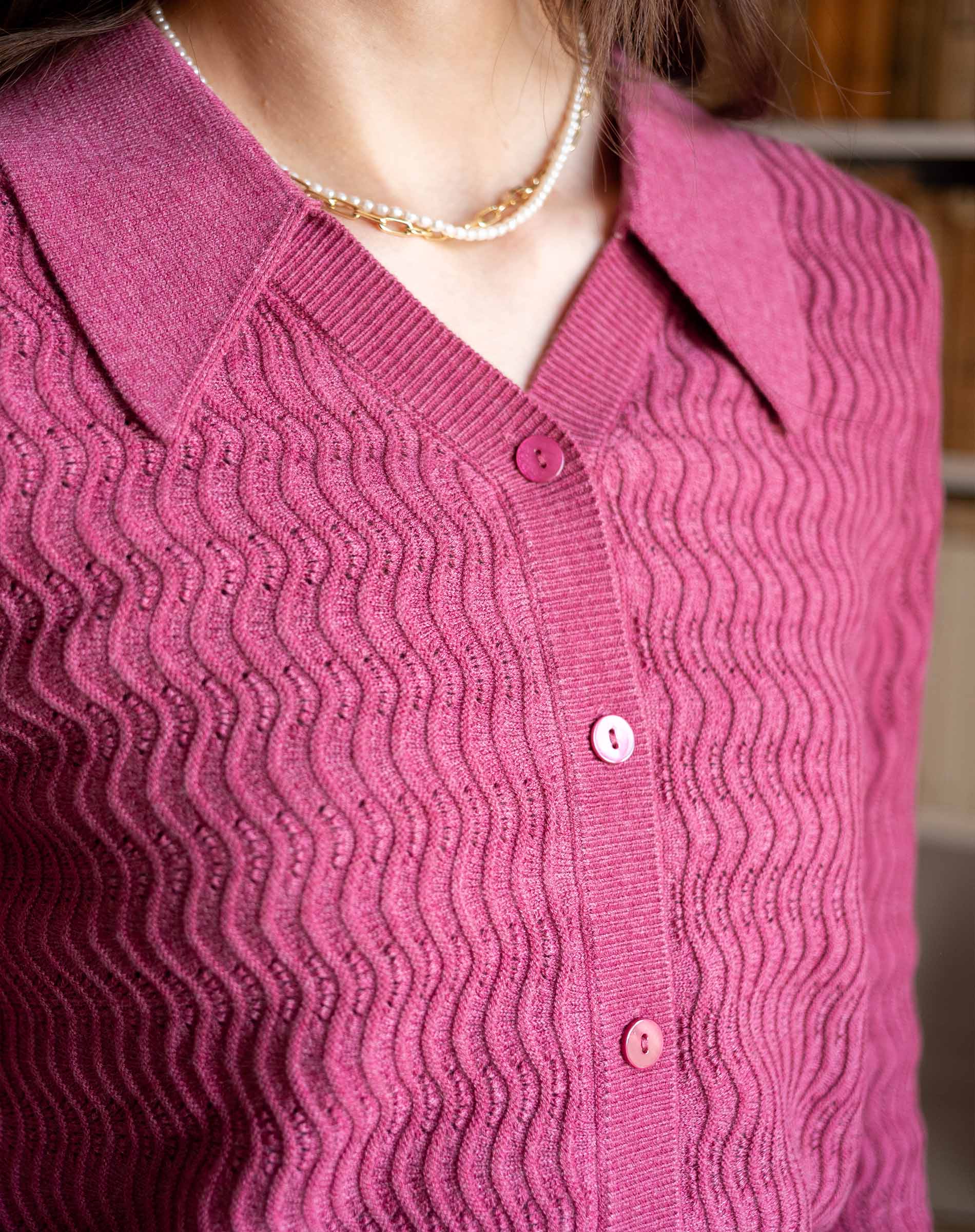 Rhubarb color button-down knit sweater with textured ribbed weave and collar