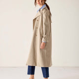 MERSEA ladies' travel-ready khaki double-breasted trench coat in a lightweight cotton blend with traditional button details and belted sleeves.