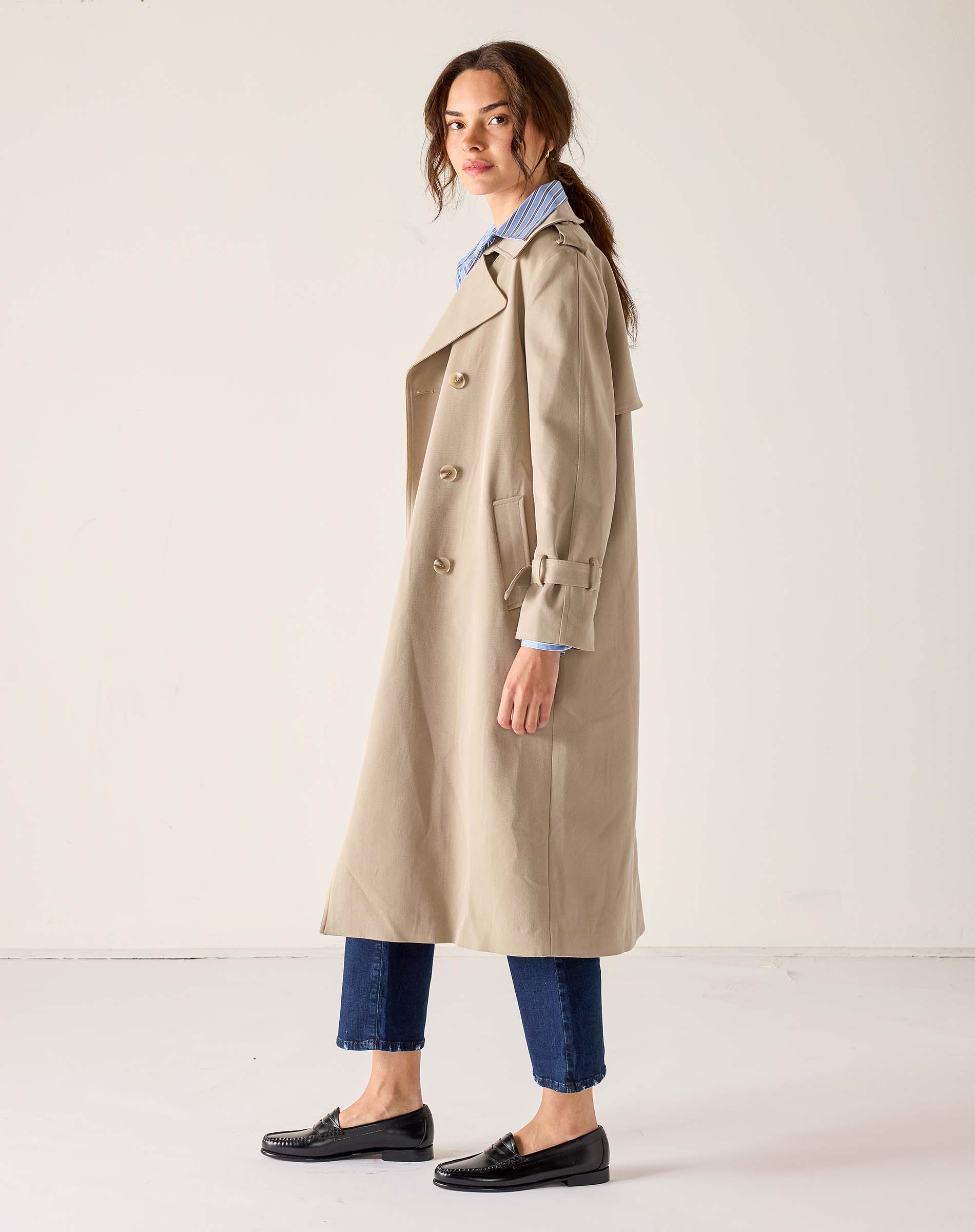 MERSEA ladies' travel-ready khaki double-breasted trench coat in a lightweight cotton blend with traditional button details and belted sleeves.