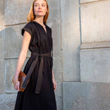 Black silk blend midi dress with pleated detailing and a cinched waist tie.