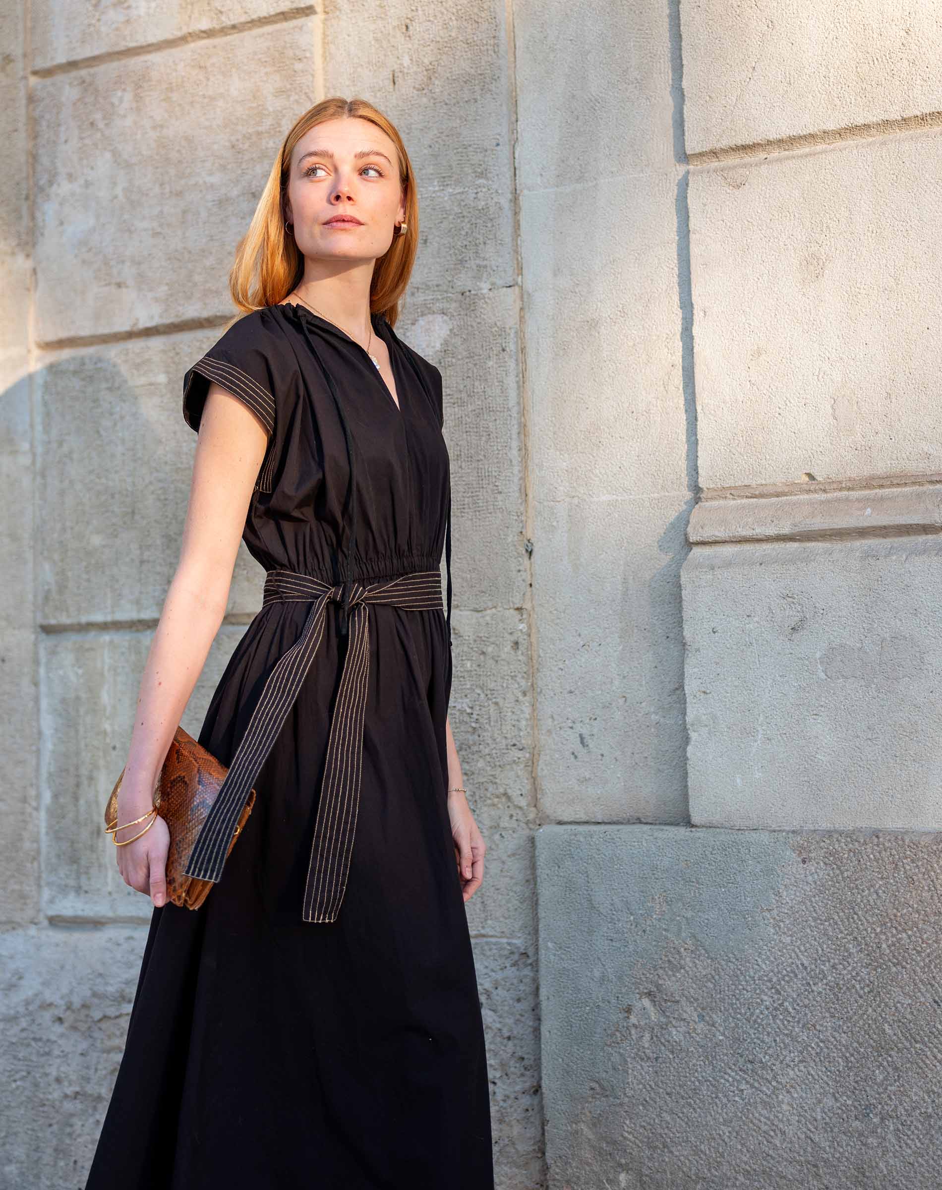 Black silk blend midi dress with pleated detailing and a cinched waist tie.