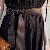 Black linen-blend dress with striped woven belt.