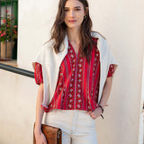 Crimson and white stripe jacquie top with a light cream short cardigan.