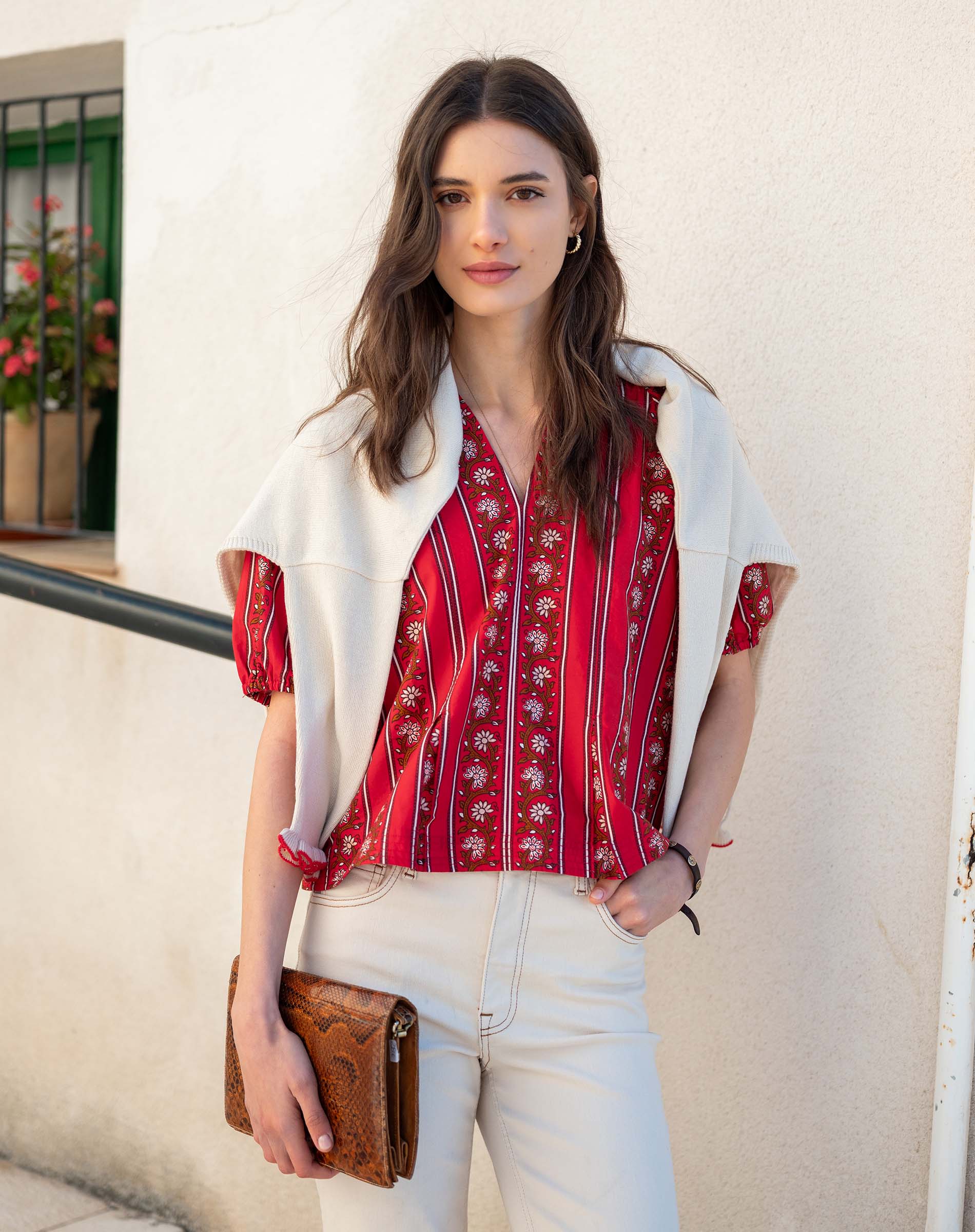Crimson and white stripe jacquie top with a light cream short cardigan.