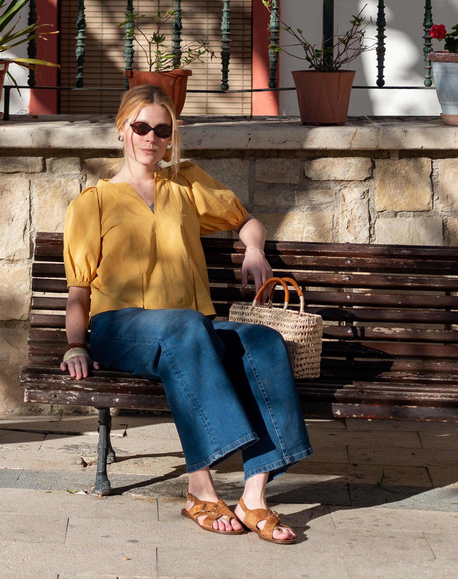 Ladies' travel-ready golden rod blouse with puffed sleeves and a V-neckline.